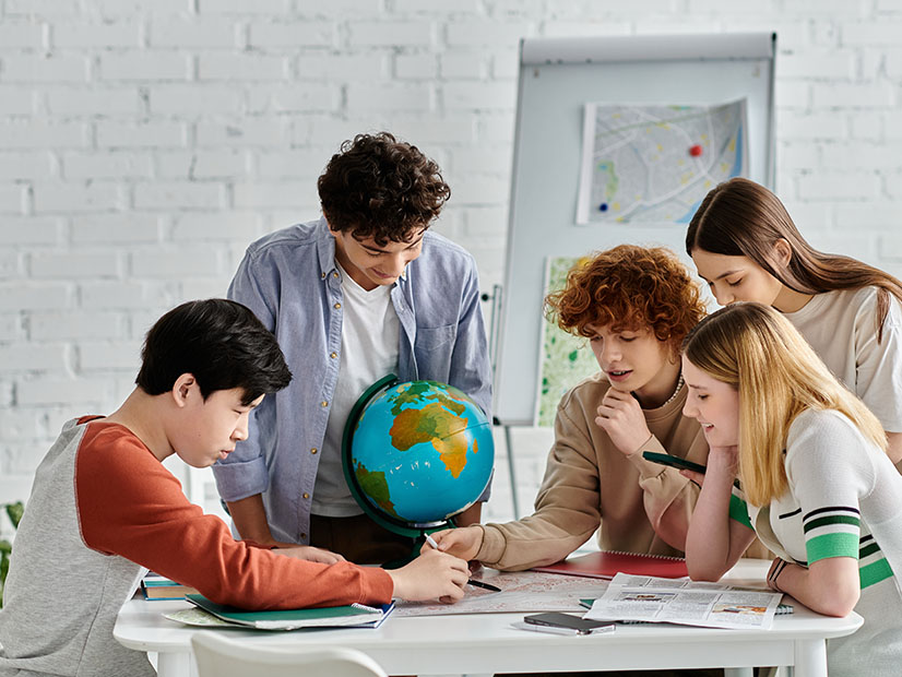 Students working around a table
