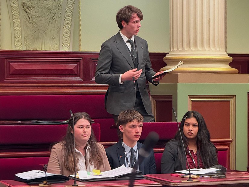 Young man presenting to a mock parliament